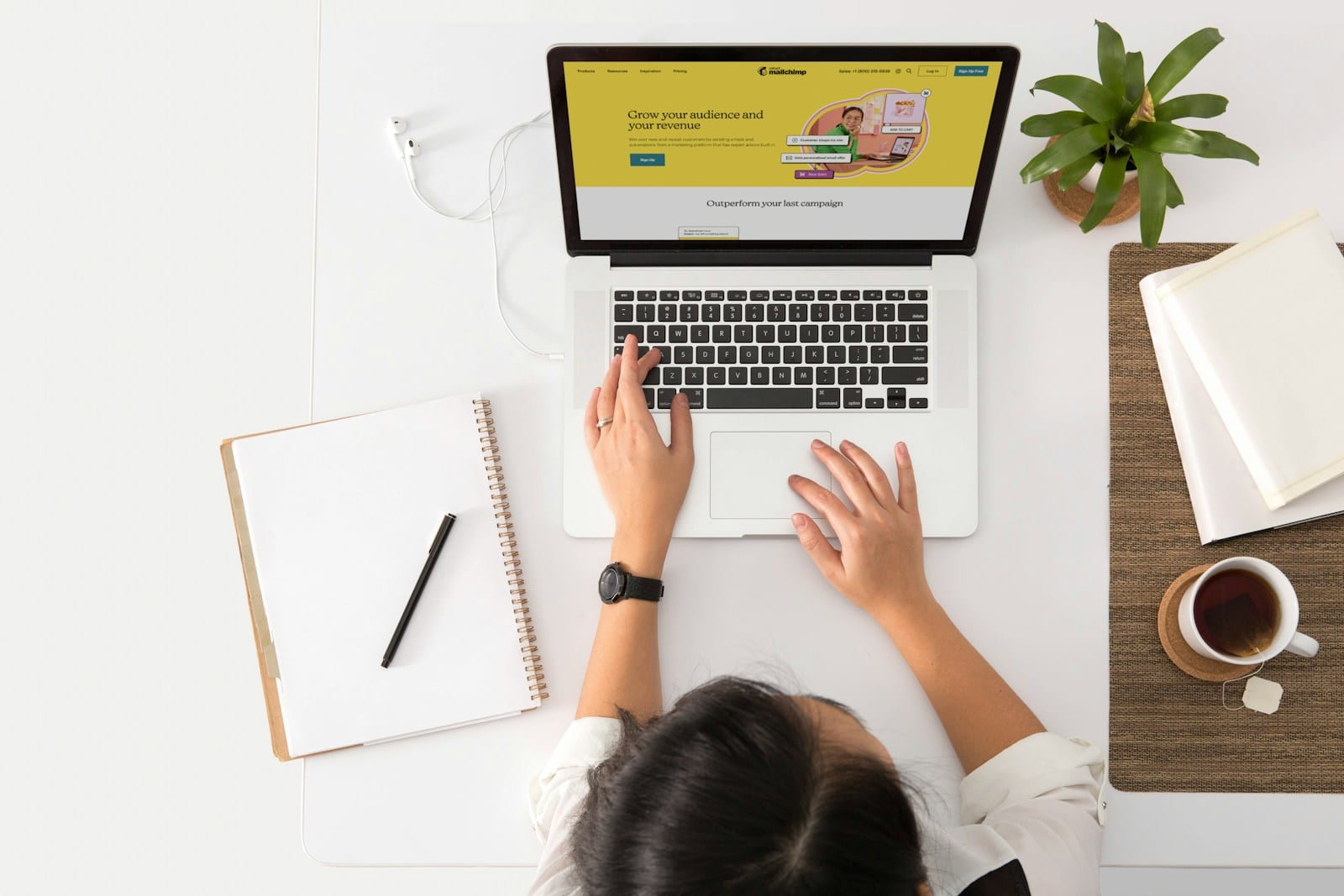 A small business owner researching at a laptop