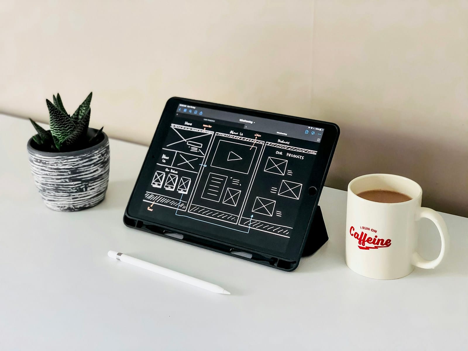 iPad on a white desk displaying a clean website layout with top navigation and clear content sections
